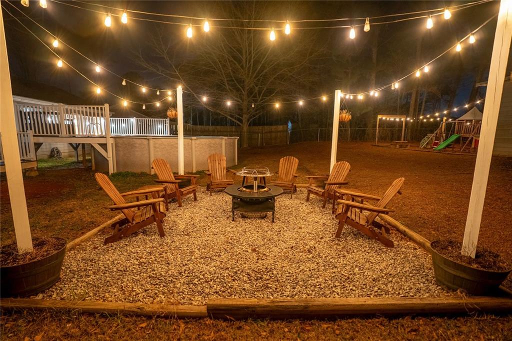 707 Reese Street Monroe, GA 30655 - Photo 6 of 61 a living room with lots of furniture and gym equipment