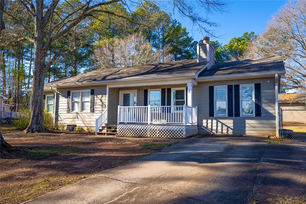 707 Reese Street Monroe, GA 30655 - Photo 10 of 61 a front view of a house with a porch