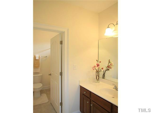 2259 Clayette Court Raleigh, NC 27612 - Photo 20 of 25 Full Bath on second floor with separate toilet area, large mirrored vanity. High celing and tile flooring. Bathroom