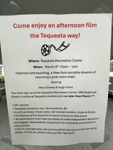 a kitchen with appliances cabinets and a table