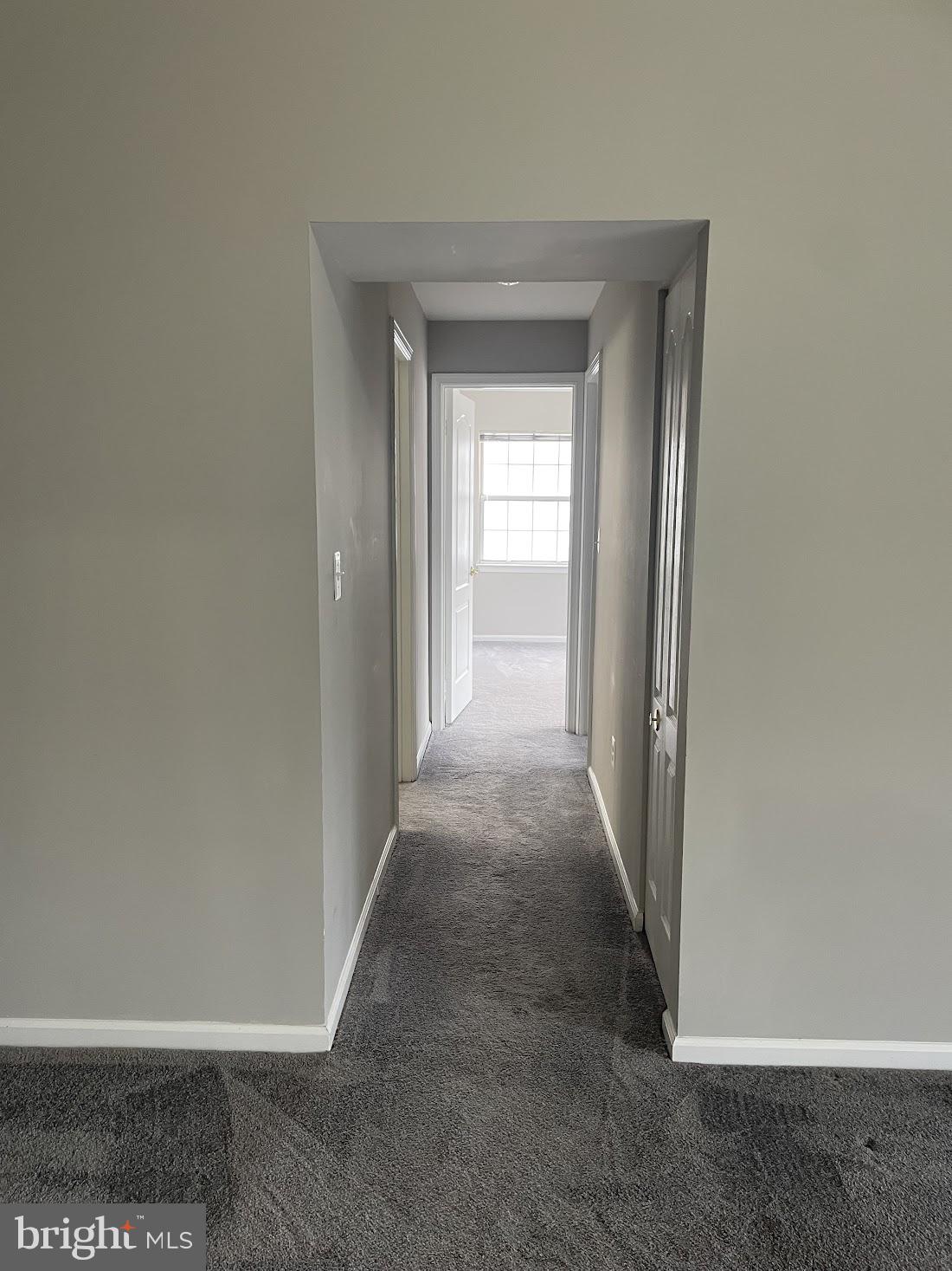 8343 Montgomery Run Road Ellicott City, MD 21043 - Photo 35 of 36 Inviting hallway with natural light.