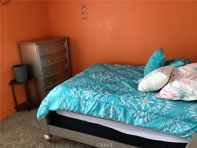 a view of a small pool and an outdoor space