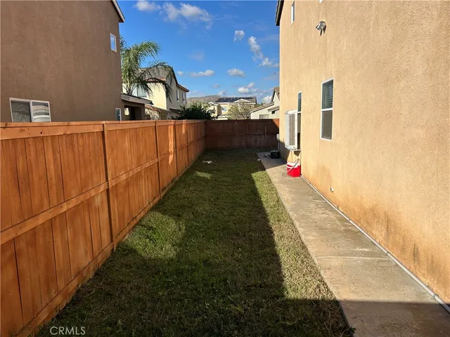 a view of a pathway both side of the house