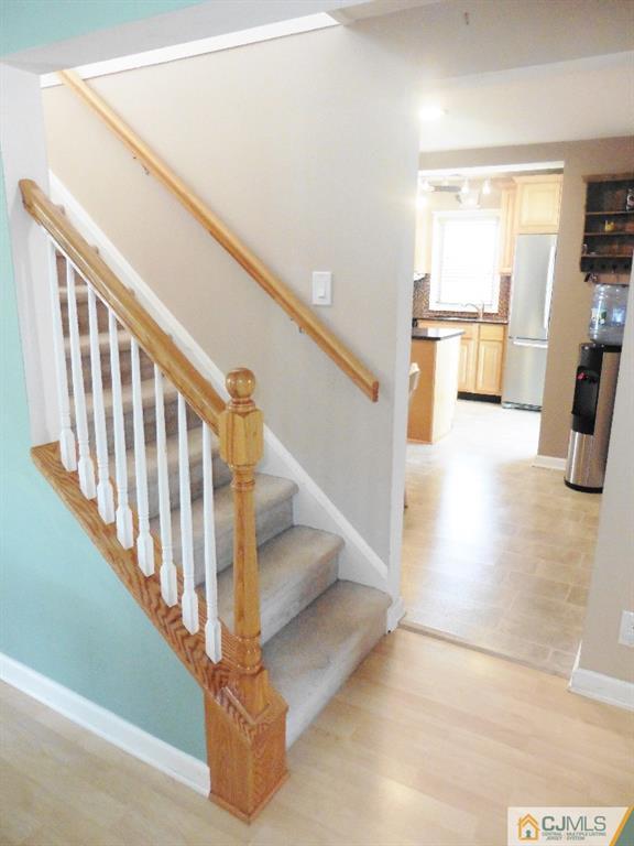 113 Highfield Road Colonia, NJ 07067 - Photo 16 of 25 a view of entryway and hall with wooden floor