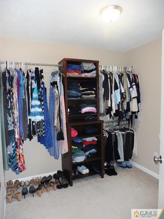 113 Highfield Road Colonia, NJ 07067 - Photo 19 of 25 a view of walk in closet with clothes