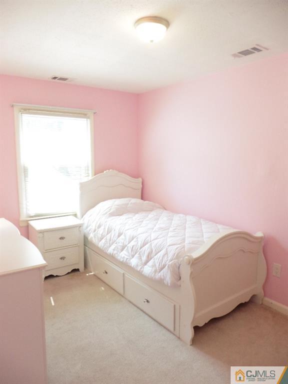 113 Highfield Road Colonia, NJ 07067 - Photo 21 of 25 a bedroom with a bed and window