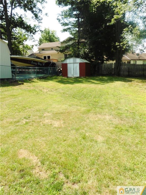 113 Highfield Road Colonia, NJ 07067 - Photo 24 of 25 a view of swimming pool with lawn chairs and plants