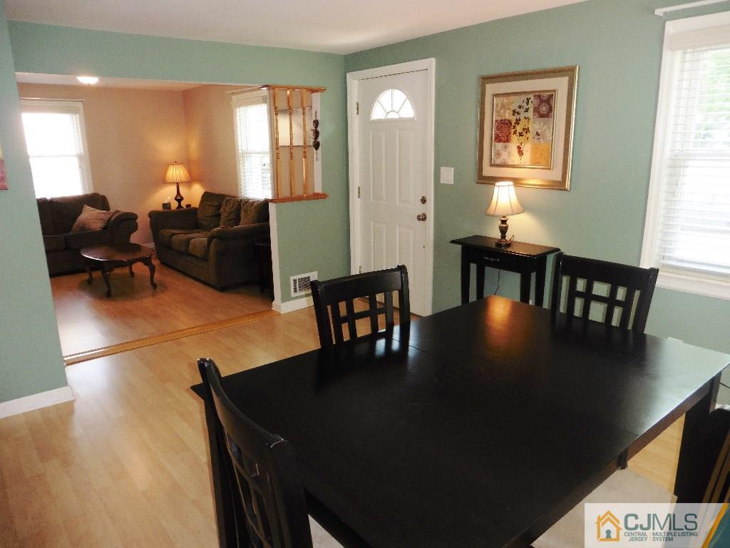 113 Highfield Road Colonia, NJ 07067 - Photo 8 of 25 a view of a dining room with furniture and wooden floor