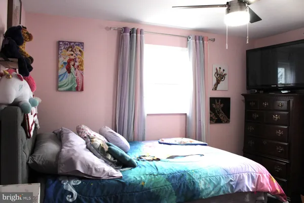 a view of a house with a yard covered in snow
