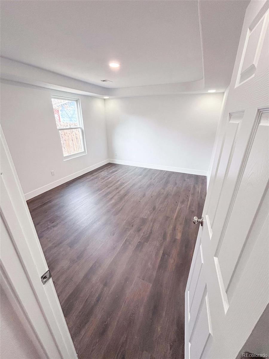 4295 Genoa Street Denver, CO 80249 - Photo 14 of 28 a view of entryway with wooden floor