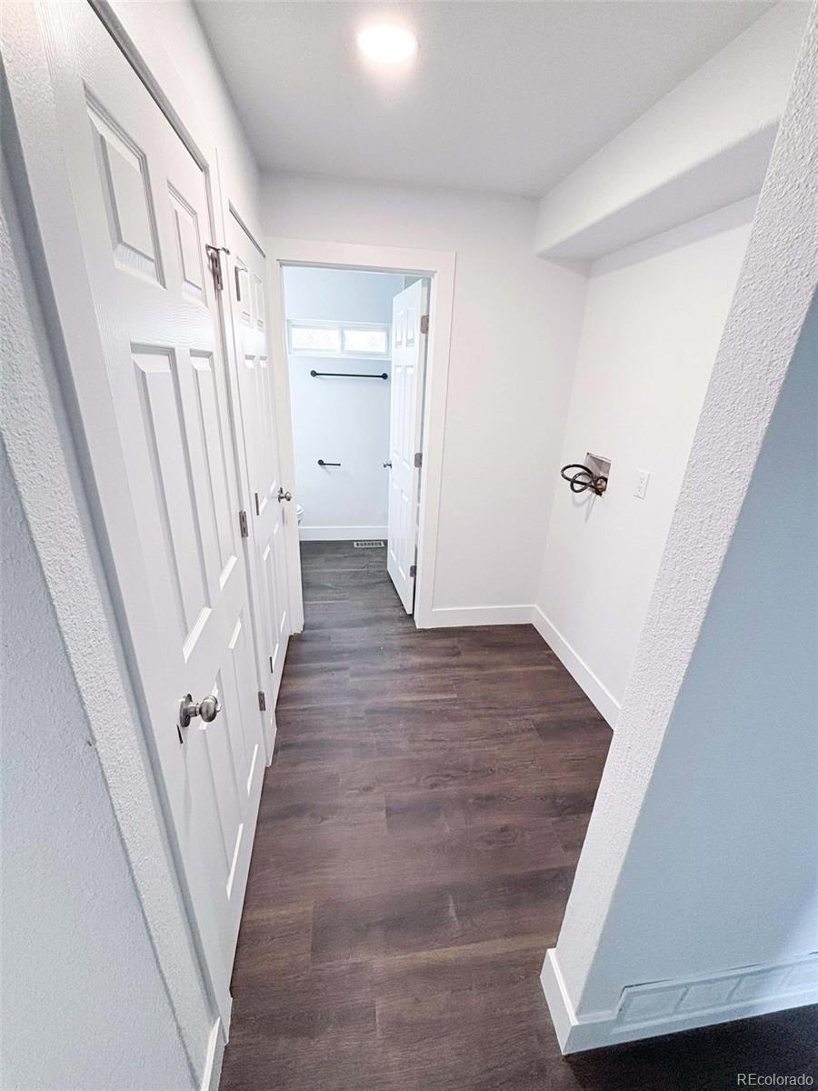 4295 Genoa Street Denver, CO 80249 - Photo 16 of 28 wooden floor with staircase