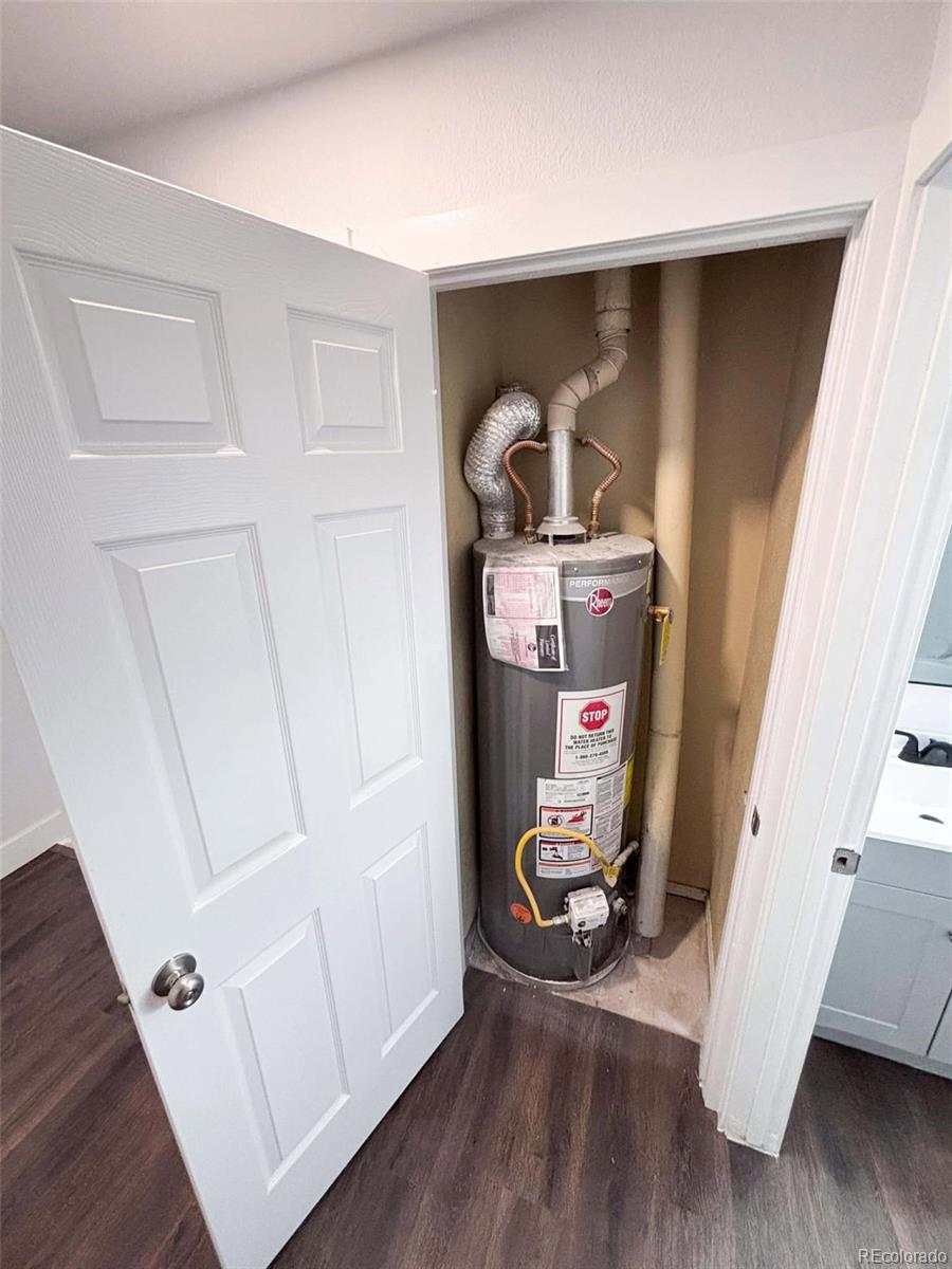 4295 Genoa Street Denver, CO 80249 - Photo 25 of 28 a room with wooden floor and white walls