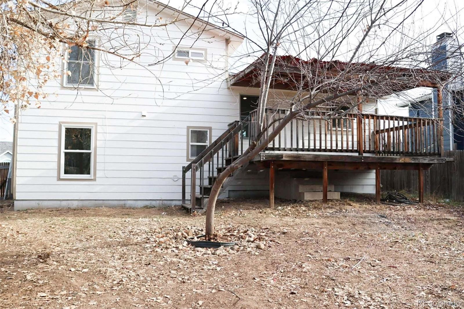 4295 Genoa Street Denver, CO 80249 - Photo 26 of 28 a view of a house with a balcony