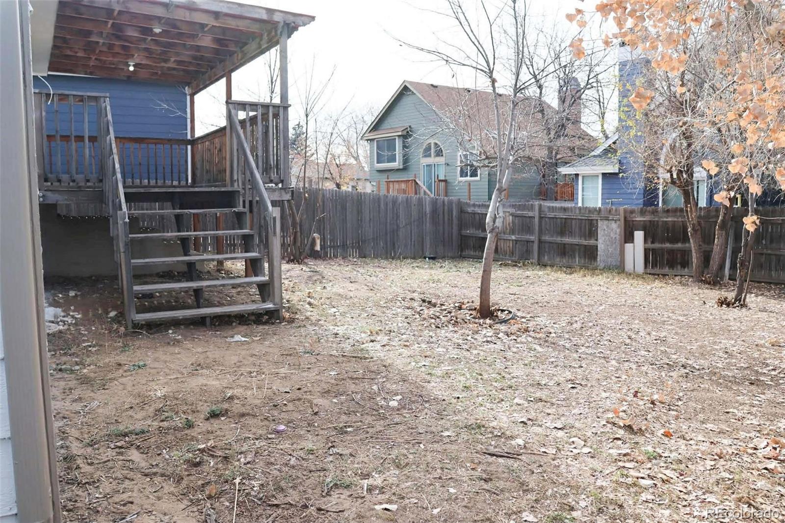 4295 Genoa Street Denver, CO 80249 - Photo 27 of 28 a view of a house with a backyard