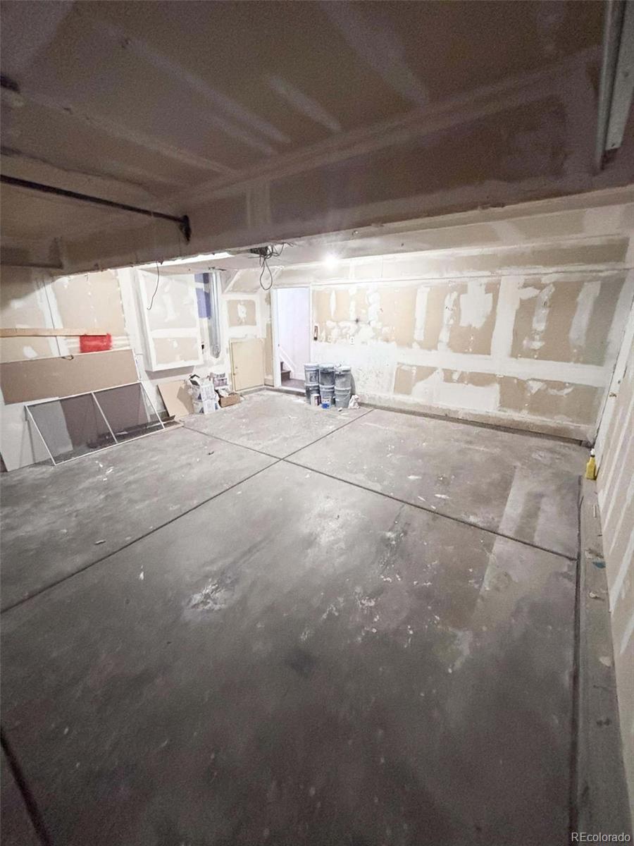 4295 Genoa Street Denver, CO 80249 - Photo 28 of 28 a room with a couch and a table