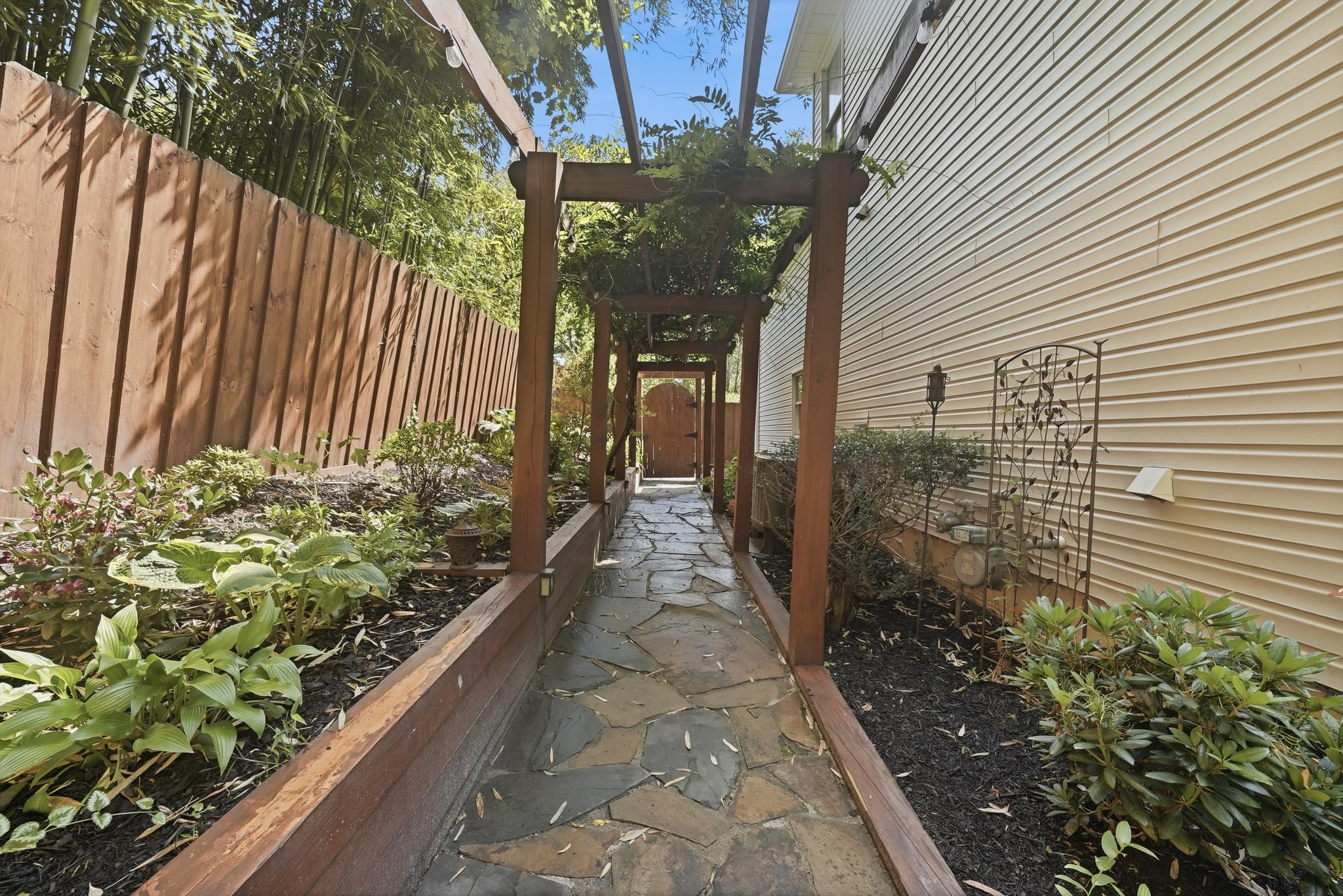 15802 Radwick Lane Silver Spring, MD 20906 - Photo 40 of 53 Pergola Walkway from Driveway to Backyard