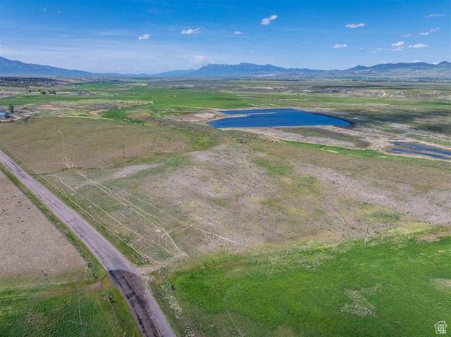 22000 South Marsh Valley Road Downey, ID 83234 - Photo 8 of 8 Aerial view of sparsely populated area with a water and mountain view