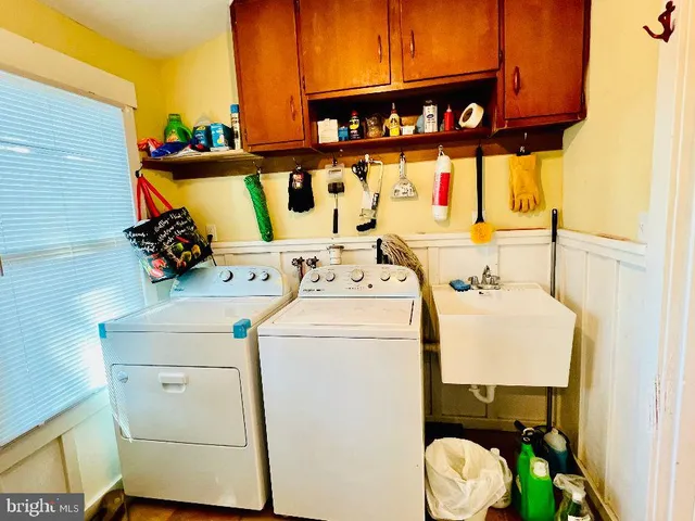 a utility room with dryer and washer