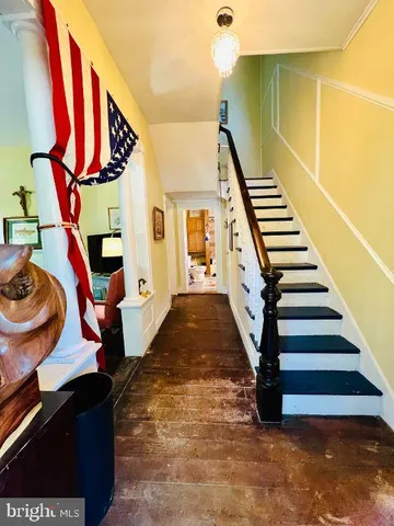 a view of an entryway with wooden floor