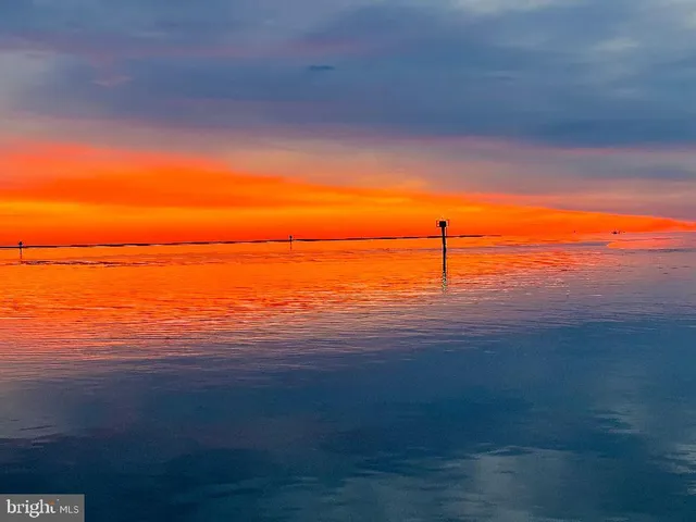 a sign that is sitting in front of house