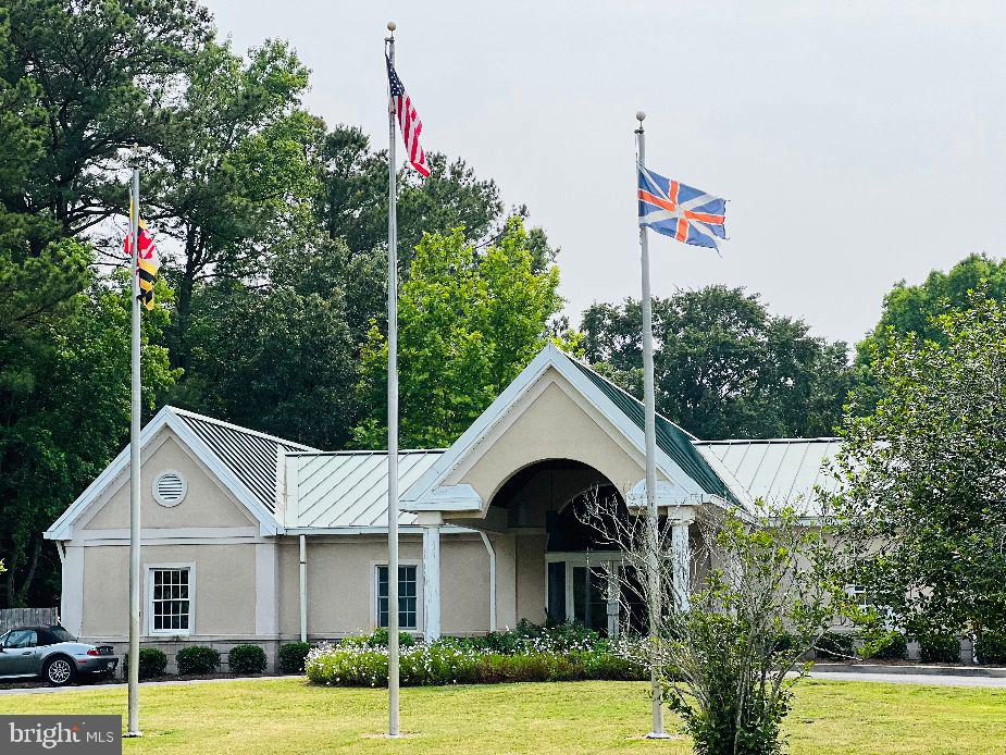 232 North Somerset Avenue Crisfield, MD 21817 - Photo 41 of 42 a front view of a house with a yard and garage