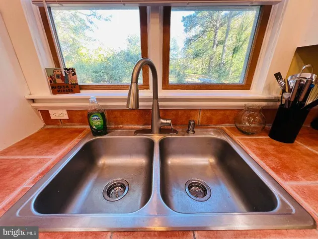 a close view of sink and a stove