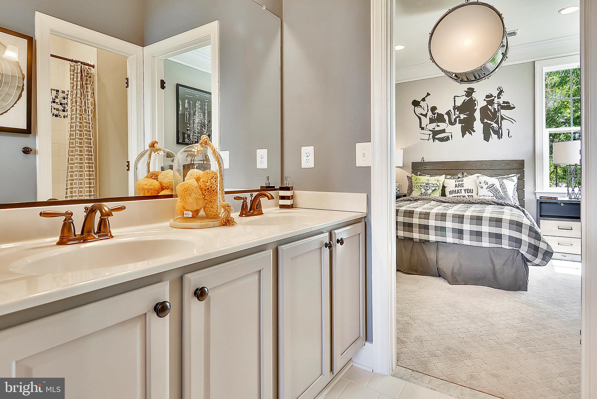3583 Longleaf Pine Brandywine, MD 20613 - Photo 13 of 27 a en suite bathroom with a double vanity sink and a mirror