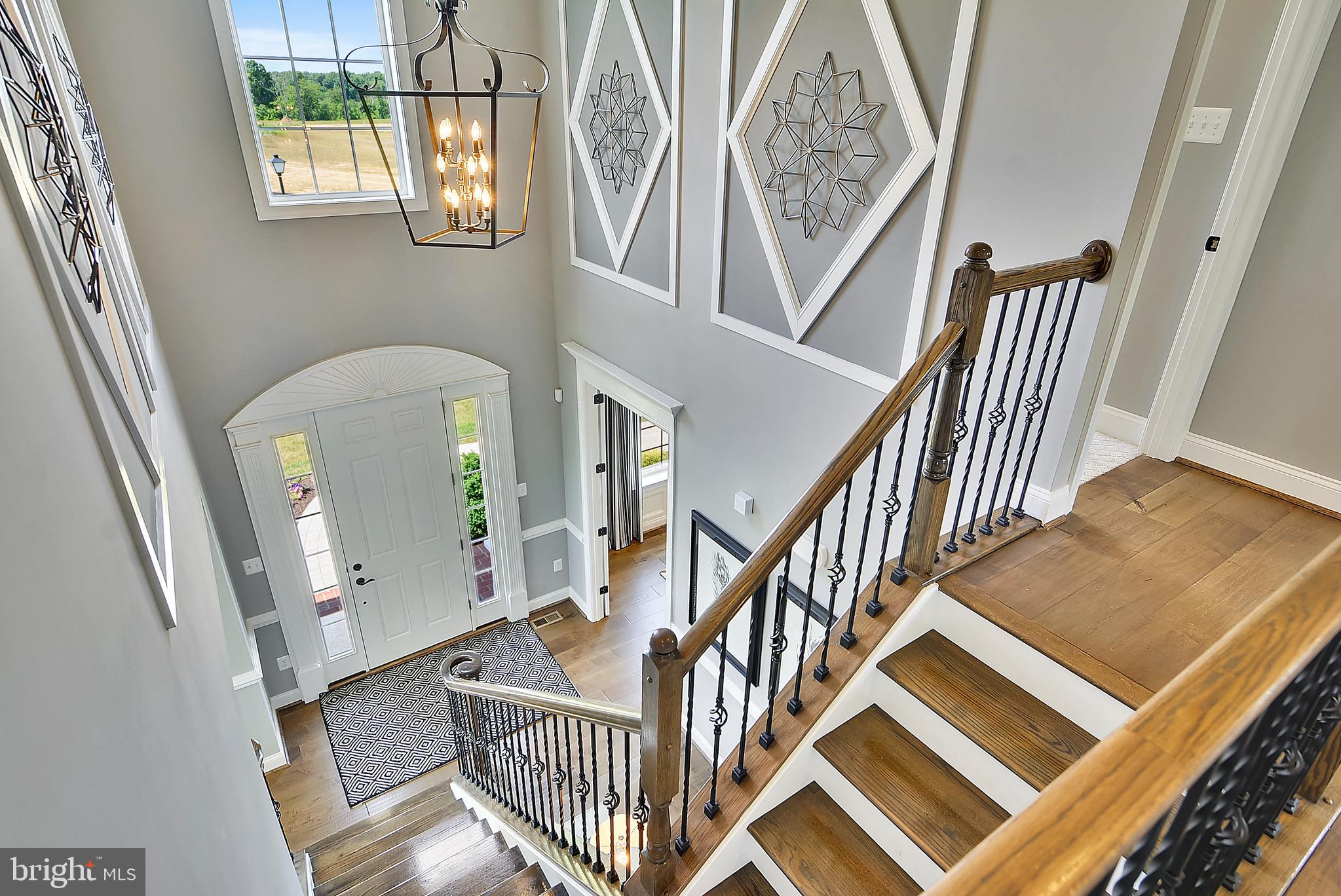 3583 Longleaf Pine Brandywine, MD 20613 - Photo 21 of 27 a view of staircase with railing and a rug