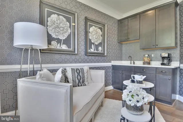 a room with a chair a mirror and a table