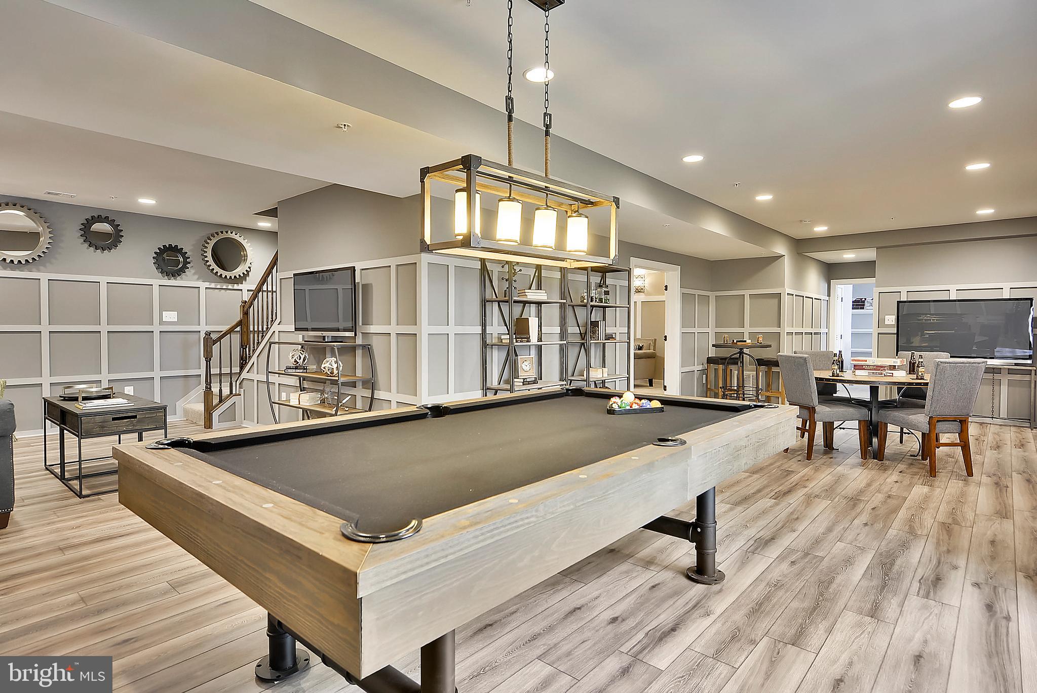 3583 Longleaf Pine Brandywine, MD 20613 - Photo 26 of 27 a living room with stainless steel appliances kitchen island granite countertop furniture and a wooden floor