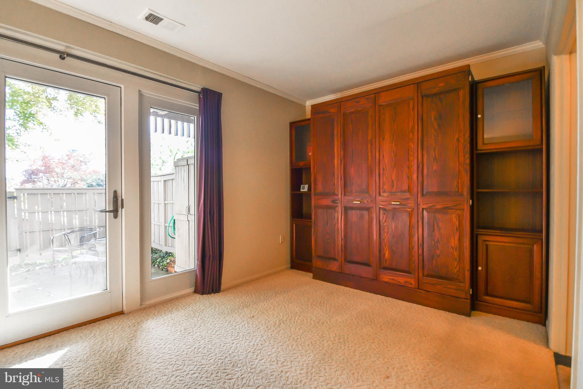 103 A Cross Keys Road, Unit R103A Baltimore, MD 21210 - Photo 14 of 19 Murphy bed with side shelves