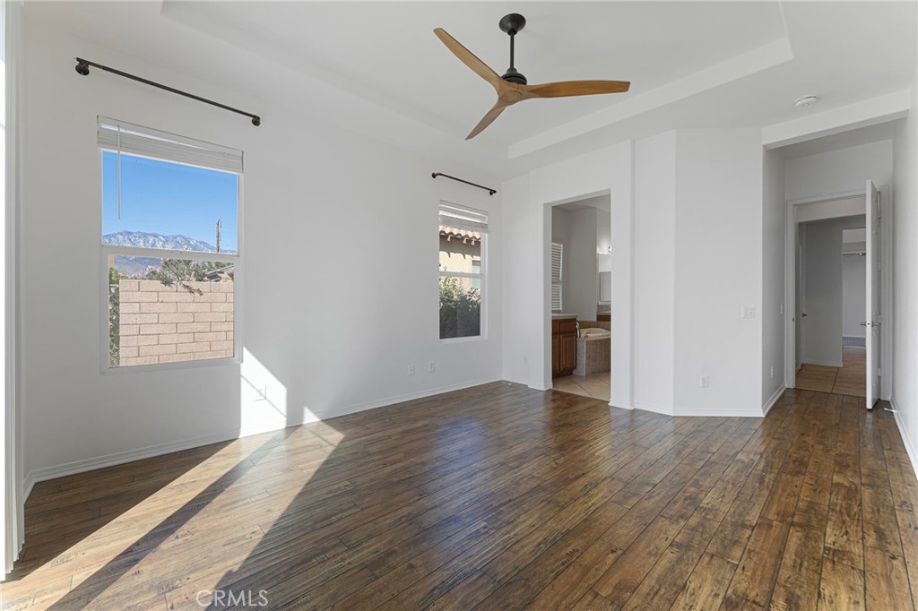 7 Lake Como Court Rancho Mirage, CA 92270 - Photo 13 of 42 a view of an empty room with wooden floor and a window