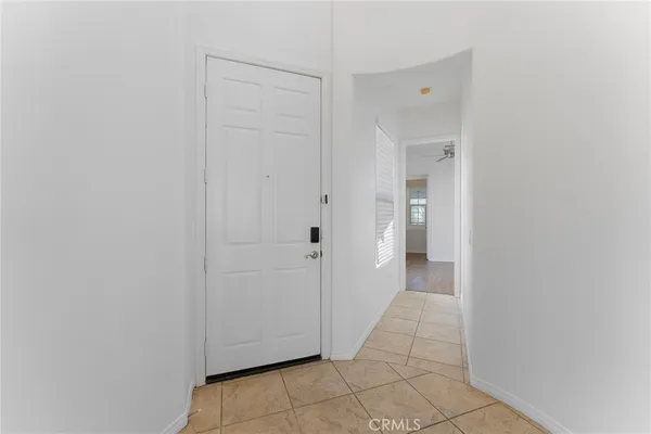 a spacious bathroom with a double vanity sink mirror and bathtub