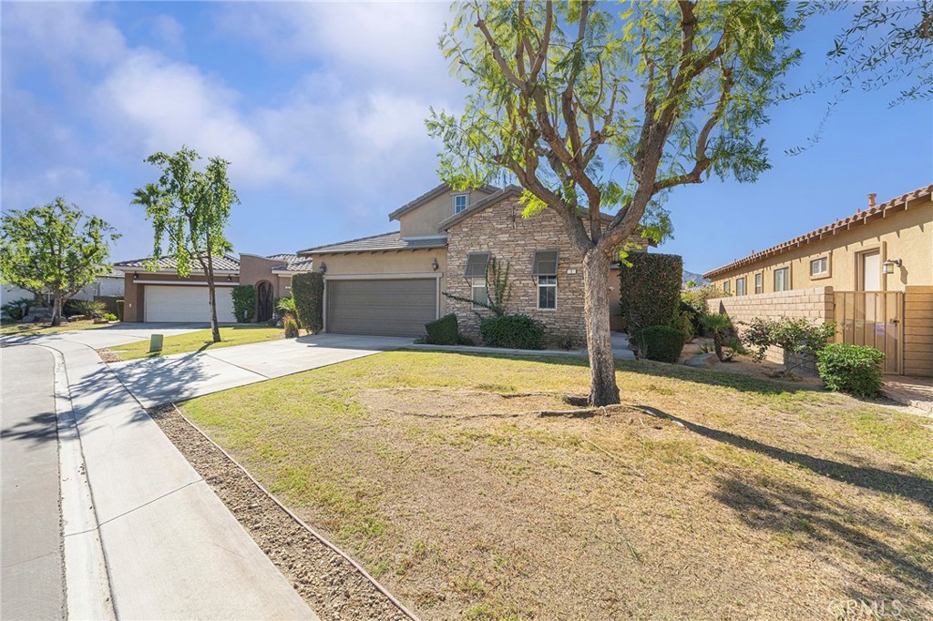 7 Lake Como Court Rancho Mirage, CA 92270 - Photo 26 of 42 a house with trees in front of it