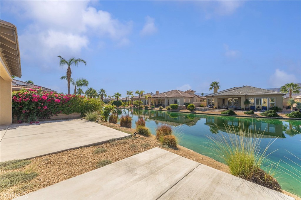 7 Lake Como Court Rancho Mirage, CA 92270 - Photo 30 of 42 a view of a lake with a building in the background