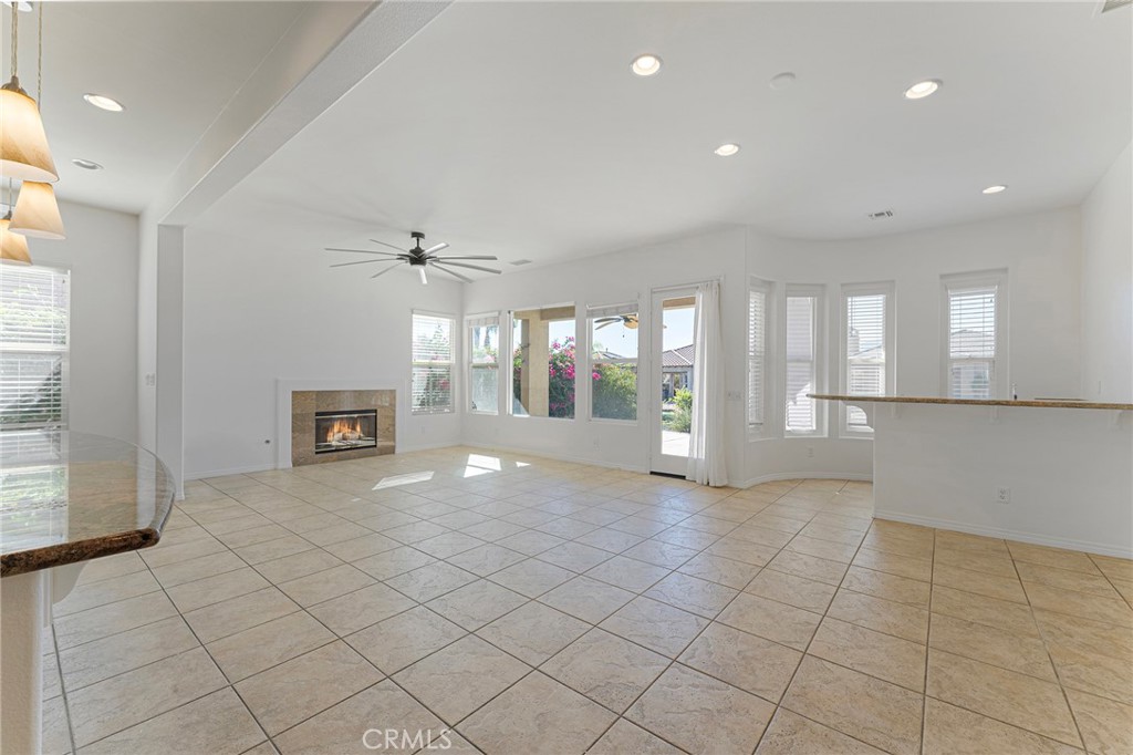 7 Lake Como Court Rancho Mirage, CA 92270 - Photo 3 of 42 a view of an empty room with a fireplace and a window