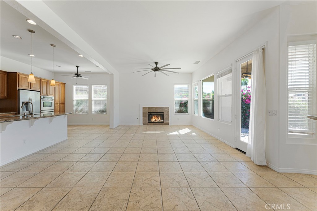 7 Lake Como Court Rancho Mirage, CA 92270 - Photo 7 of 42 a view of an empty room with a fireplace and a window
