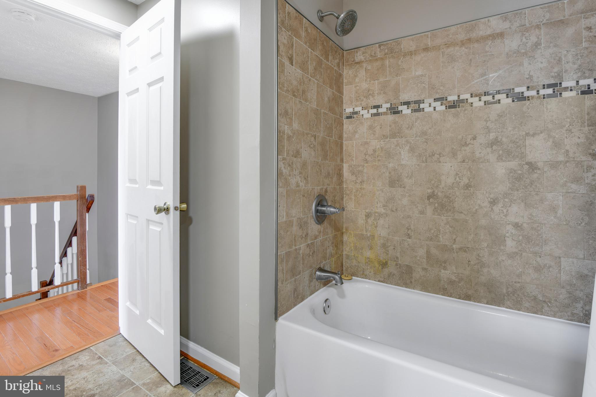 7025 Hames Court Frederick, MD 21703 - Photo 14 of 22 a bathroom with a bathtub and a shower