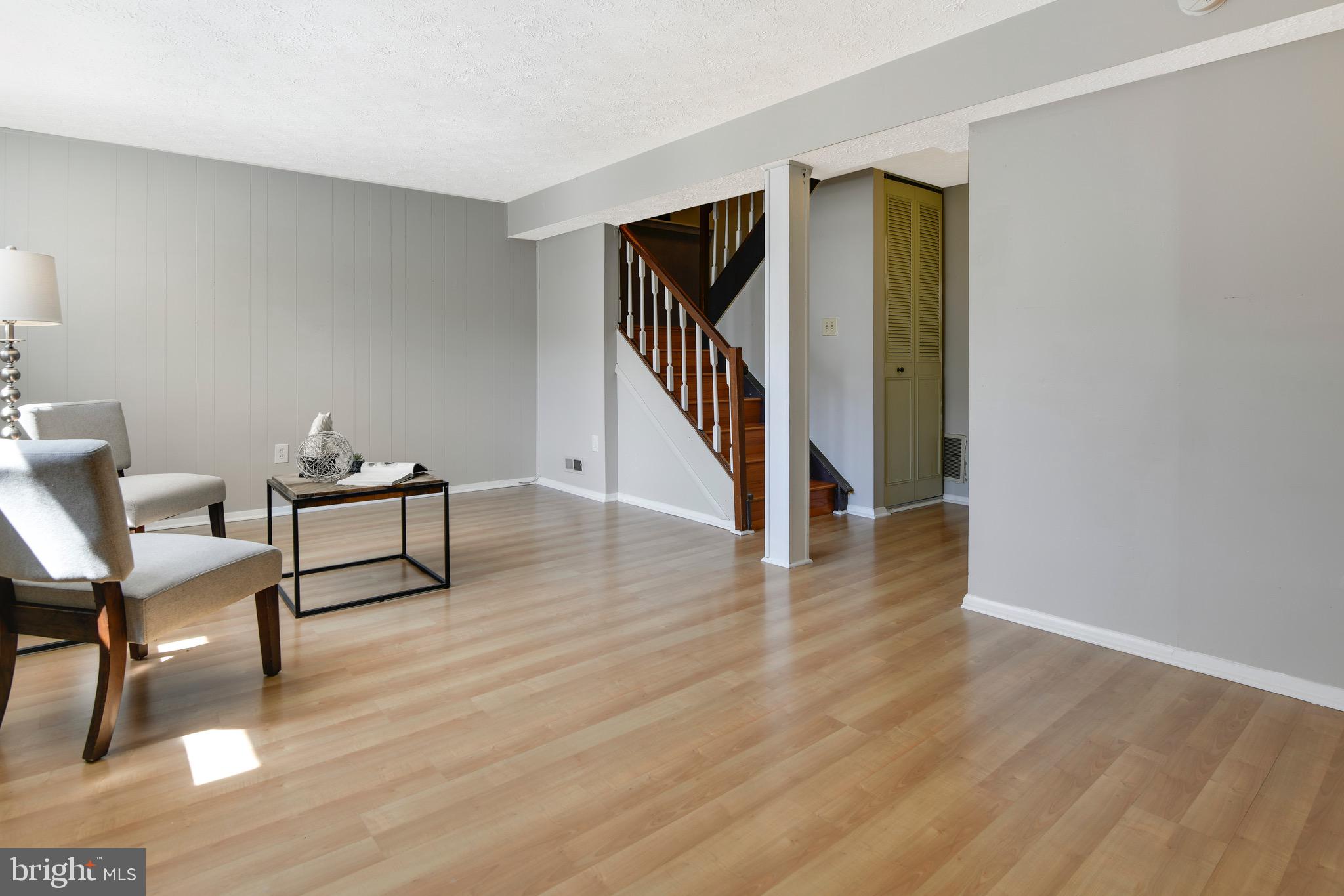 7025 Hames Court Frederick, MD 21703 - Photo 17 of 22 a view of a livingroom with furniture and hardwood floor