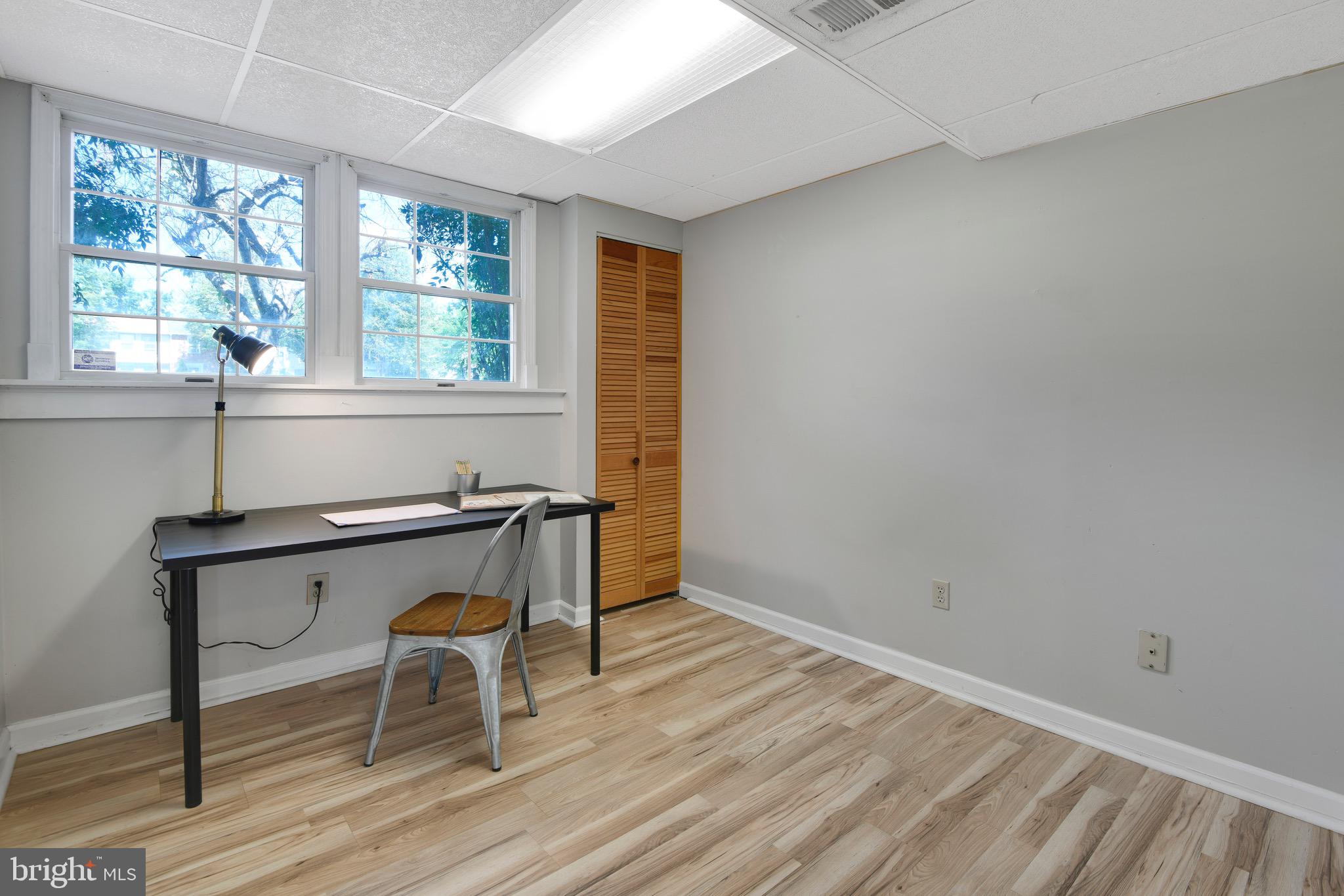 7025 Hames Court Frederick, MD 21703 - Photo 19 of 22 an empty room with wooden floor and windows
