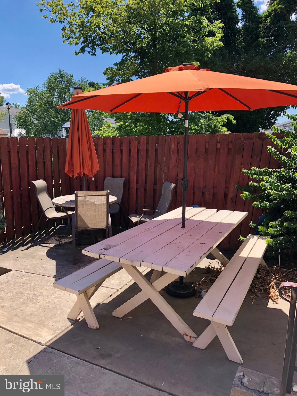 7025 Hames Court Frederick, MD 21703 - Photo 21 of 22 a patio with a table and chairs