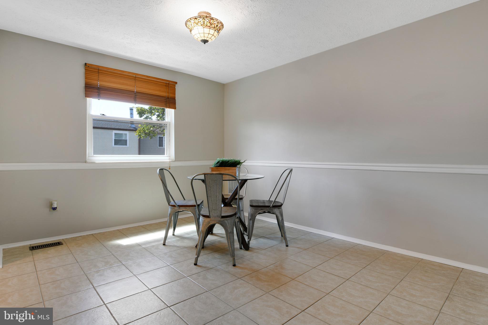 7025 Hames Court Frederick, MD 21703 - Photo 8 of 22 a dining room with furniture and window