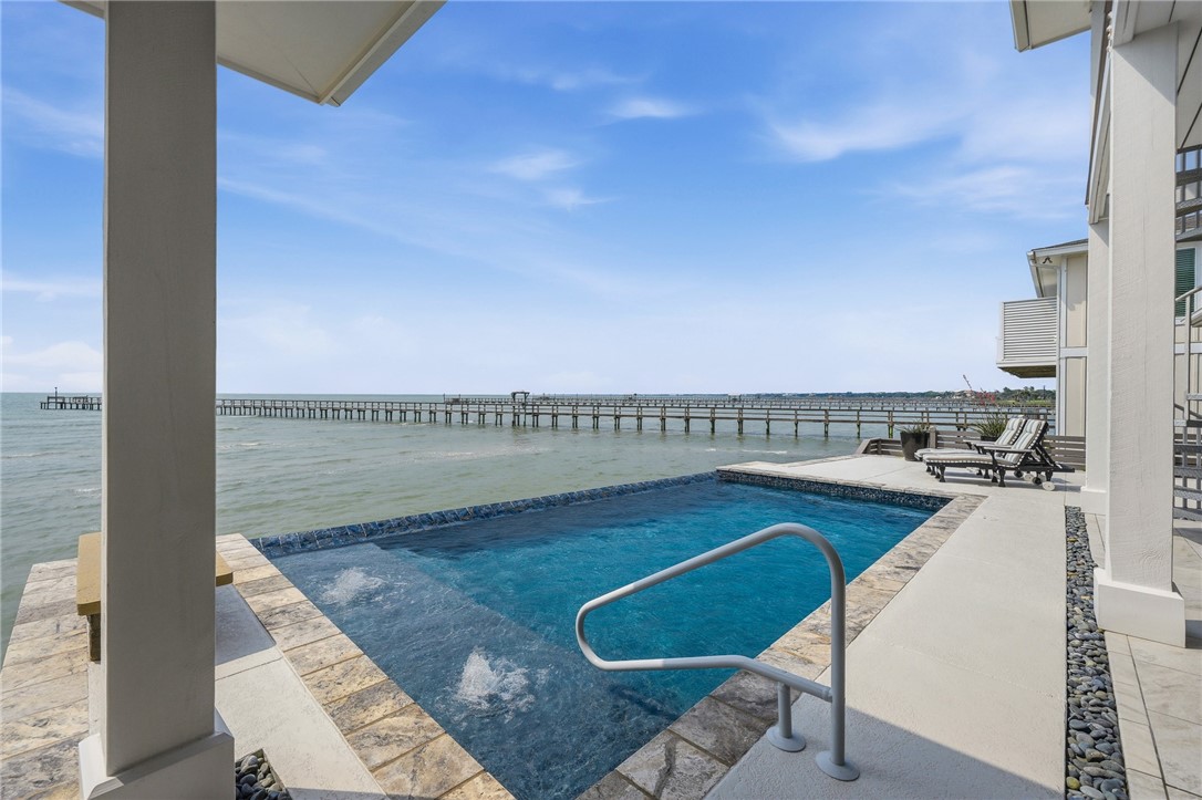 12 Sea Shell Shores Rockport, TX 78382 - Photo 31 of 40 a view of a swimming pool and an outdoor seating
