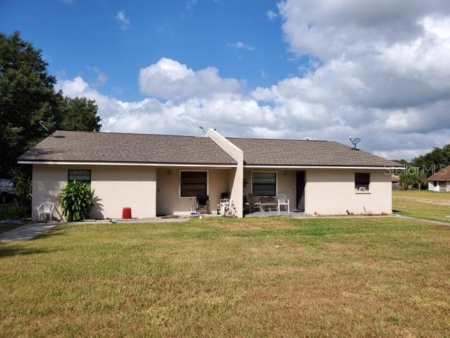3624 Willow Oak Road Mulberry, FL 33860 - Photo 1 of 1 a front view of a house with yard and garage