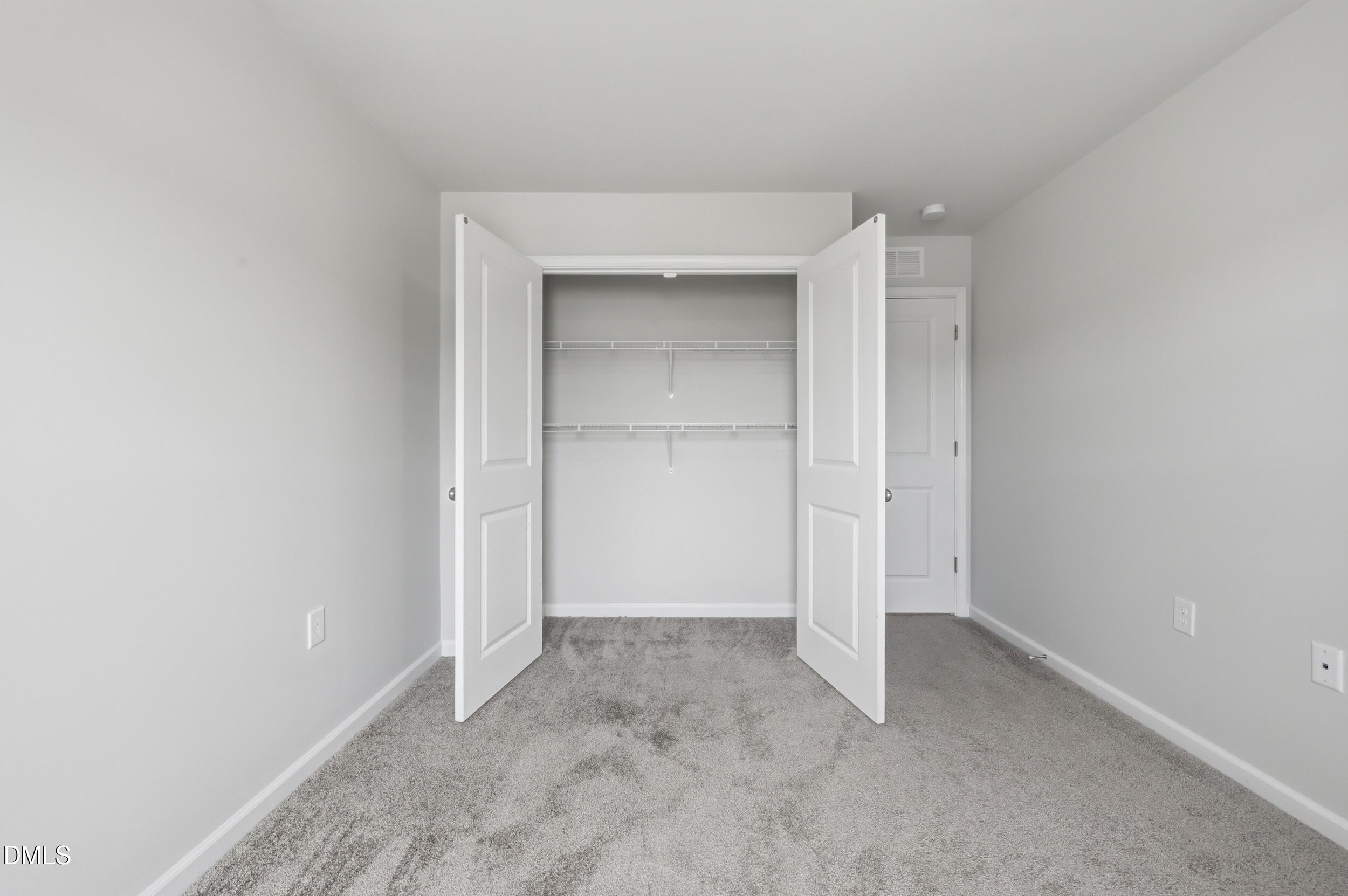 5011 Kota Street Raleigh, NC 27610 - Photo 19 of 42 an empty room with closet