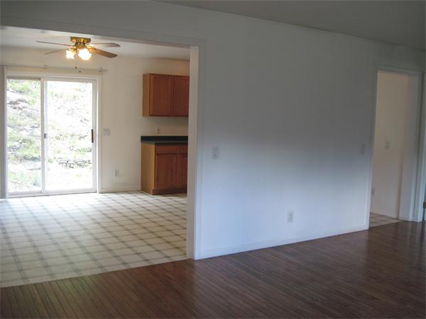 173 East Princeton Road Princeton, MA 01541 - Photo 14 of 30 an empty room with wooden floor and windows
