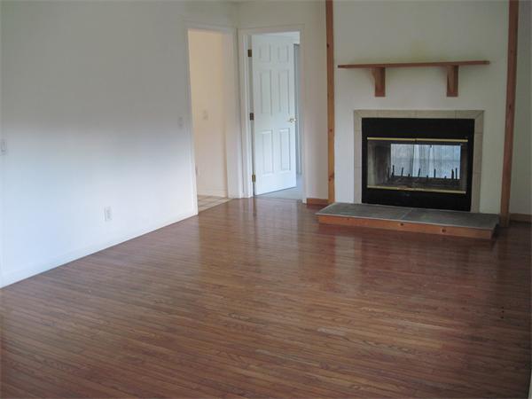 173 East Princeton Road Princeton, MA 01541 - Photo 15 of 30 a view of an empty room with wooden floor fireplace and a window