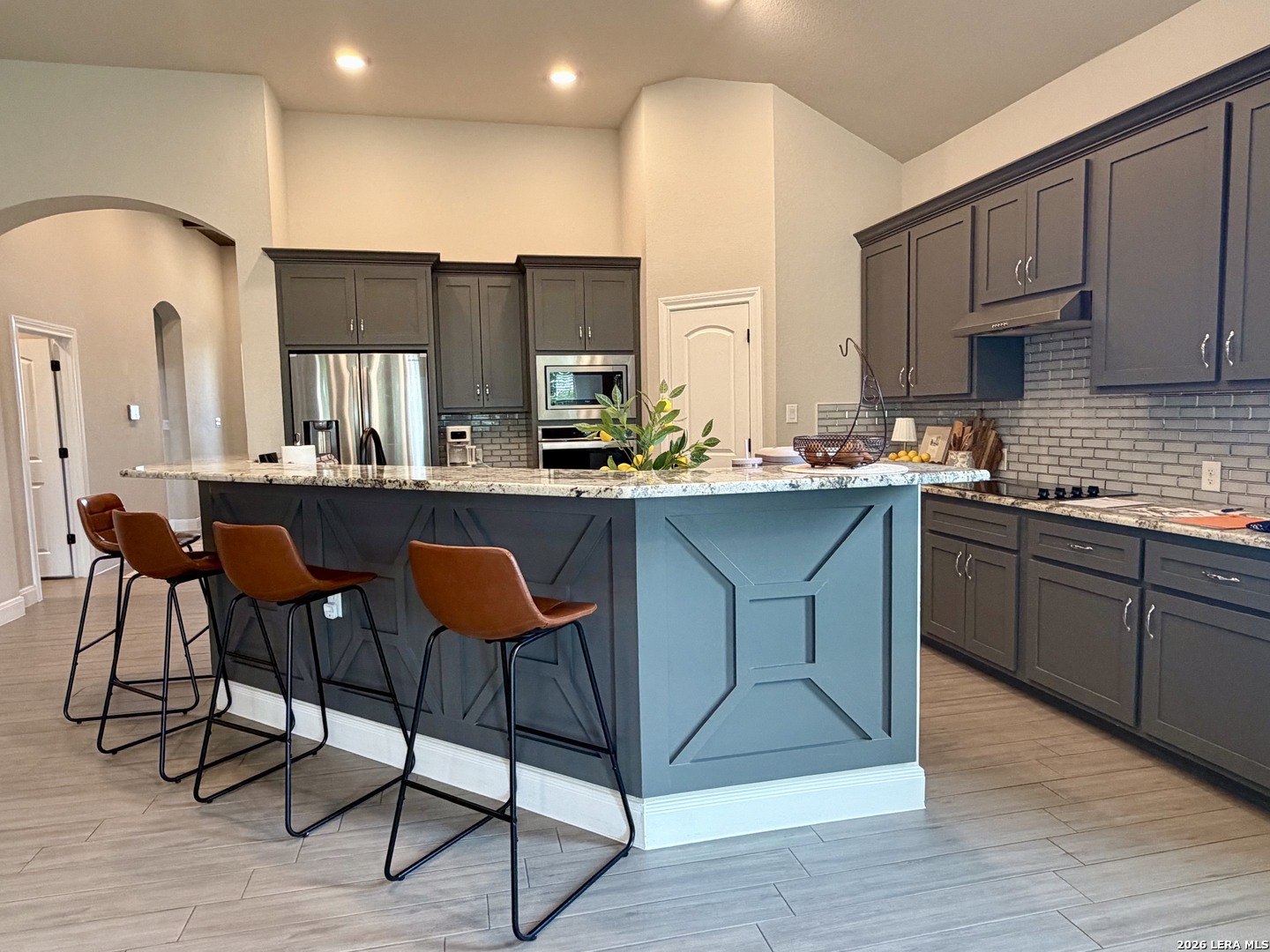 615 Abbott Ridge Converse, TX 78109 - Photo 10 of 26 a kitchen with stainless steel appliances a sink a stove a refrigerator cabinets and dining table