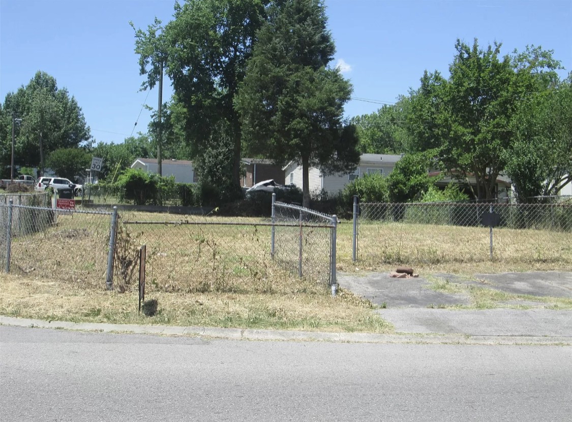 1233 Bubbling Well Road Madison, TN 37115 - Photo 2 of 2 a backyard of a house with trees