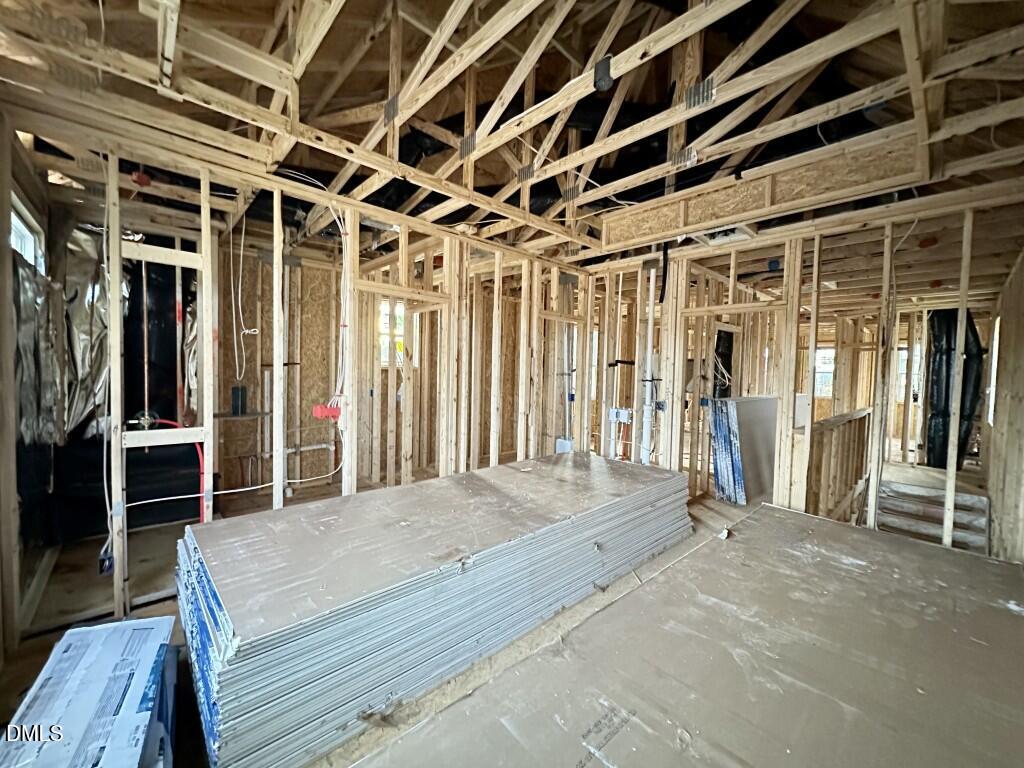 1030 Old Knight Road Knightdale, NC 27545 - Photo 10 of 13 a spacious bedroom with a bed and a large mirror
